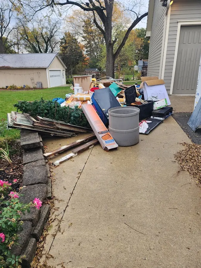 Dumpster being loaded with debris for Commercial Dumpster Rental in Palos Hills